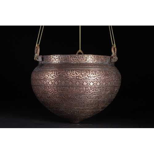 38 - A Cast Brass Hanging Lamp with Arabic Inscriptions, Deccan or Persia, 16th–17th Century.

This cast ... 