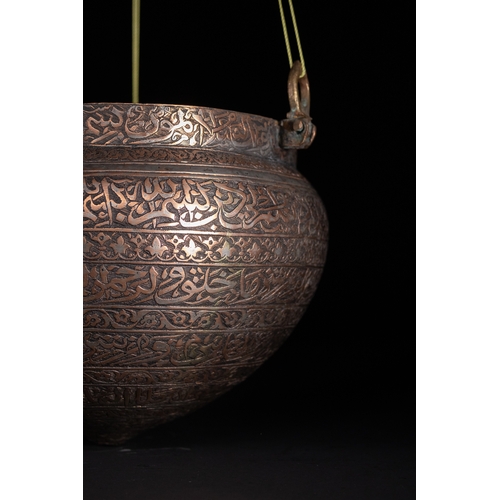 38 - A Cast Brass Hanging Lamp with Arabic Inscriptions, Deccan or Persia, 16th–17th Century.

This cast ... 