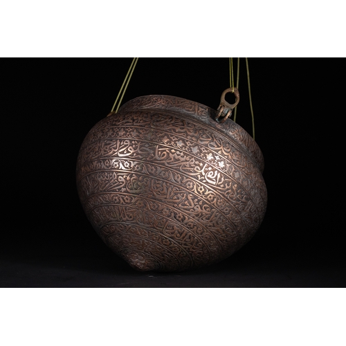 38 - A Cast Brass Hanging Lamp with Arabic Inscriptions, Deccan or Persia, 16th–17th Century.

This cast ... 