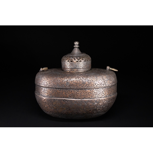 39 - A Rare Safavid Tinned Copper Lidded Kashkul Beggar's Bowl with Arabic Inscriptions, 17th Century.

A... 