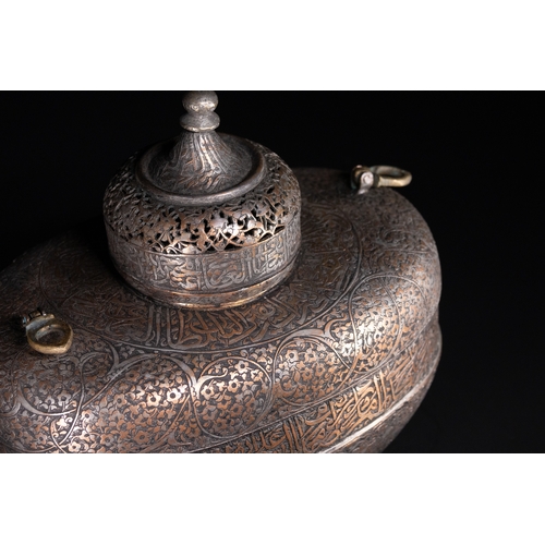 39 - A Rare Safavid Tinned Copper Lidded Kashkul Beggar's Bowl with Arabic Inscriptions, 17th Century.

A... 