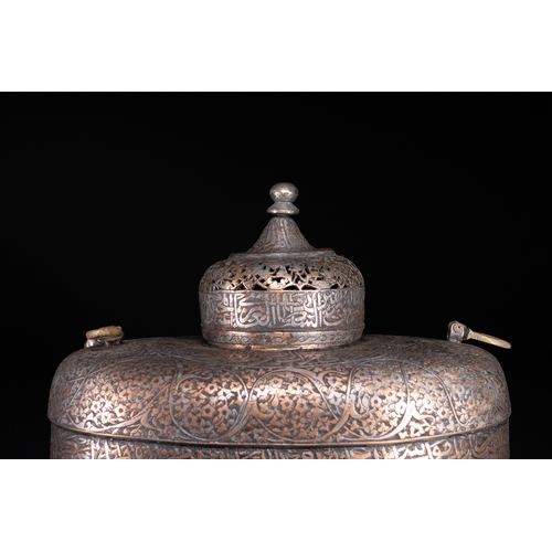 39 - A Rare Safavid Tinned Copper Lidded Kashkul Beggar's Bowl with Arabic Inscriptions, 17th Century.

A... 