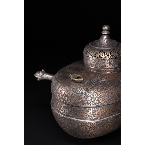 39 - A Rare Safavid Tinned Copper Lidded Kashkul Beggar's Bowl with Arabic Inscriptions, 17th Century.

A... 