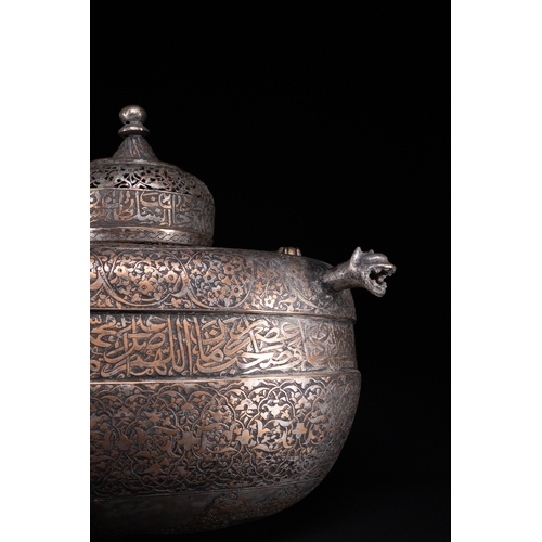 39 - A Rare Safavid Tinned Copper Lidded Kashkul Beggar's Bowl with Arabic Inscriptions, 17th Century.

A... 