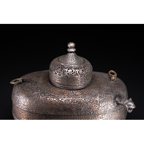 39 - A Rare Safavid Tinned Copper Lidded Kashkul Beggar's Bowl with Arabic Inscriptions, 17th Century.

A... 