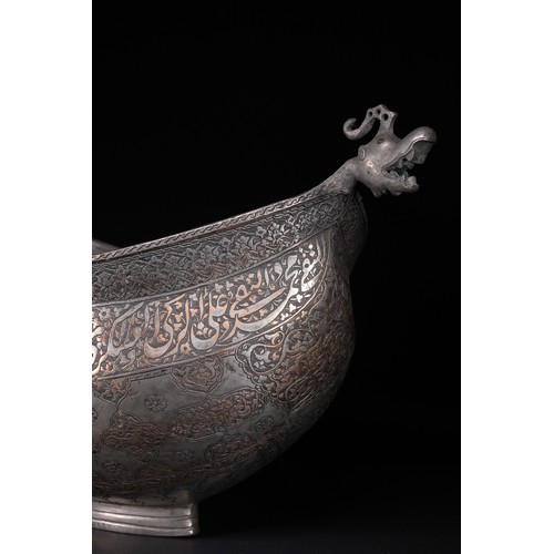 40 - A Safavid Tinned Copper Calligraphic Kashkul Beggar's Bowl, 17th Century.

This finely hammered hemi... 