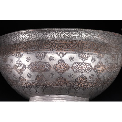 40 - A Safavid Tinned Copper Calligraphic Kashkul Beggar's Bowl, 17th Century.

This finely hammered hemi... 