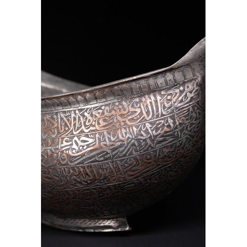 41 - A Tinned Copper Islamic Kashkul Beggar's Bowlwith Dragon-Head Handles, Deccan, 17th Century.

The ka... 