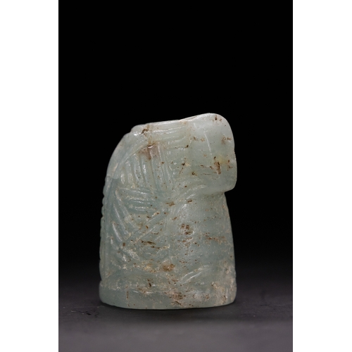 45 - An Islamic Aquamarine Chess Piece, 12th Century.

Carved from aquamarine stone, this chess piece fea... 