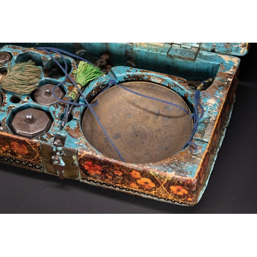 48 - A Qajar Lacquered Merchant’s Scale Box Signed by Hashim of Isfahan, 19th Century.

A richly decorate... 