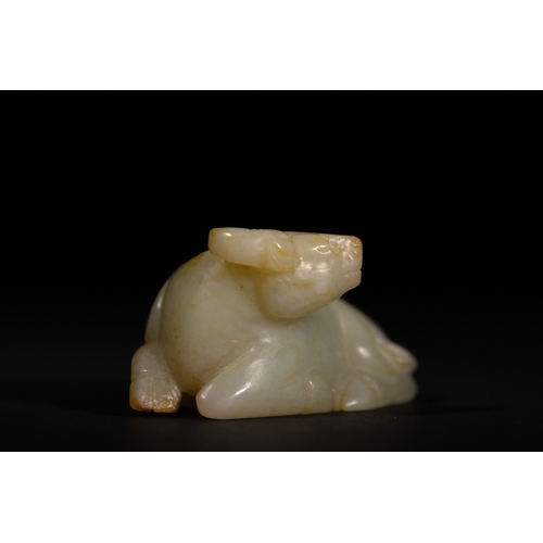 382 - A Chinese Jade Carving of a Recumbent Buffalo. 
The jade carving depicts a buffalo in a resting posi... 
