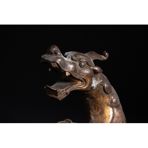 318 - A Chinese Gilt-Bronze 'Qilin' Censer, 19th Century - A cast bronze vessel sculpted in the form of a ... 