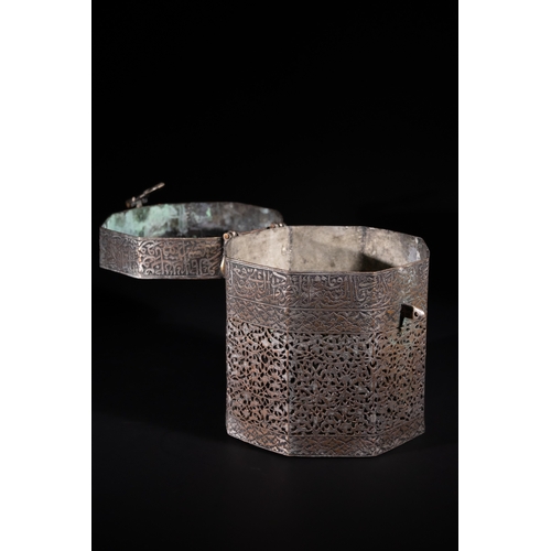 117 - An Indo-Persian Pierced Calligraphic Tinned Copper Casket, 19th Century - An octagonal metal casket,... 
