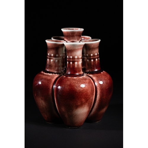 270 - A Chinese Sang de Boeuf Glazed Porcelain Five-Neck Vase - A multi-necked porcelain vase featuring a ... 