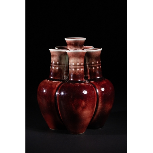 270 - A Chinese Sang de Boeuf Glazed Porcelain Five-Neck Vase - A multi-necked porcelain vase featuring a ... 