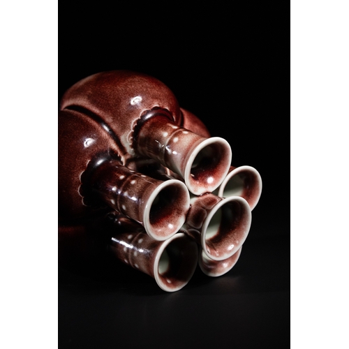 270 - A Chinese Sang de Boeuf Glazed Porcelain Five-Neck Vase - A multi-necked porcelain vase featuring a ... 