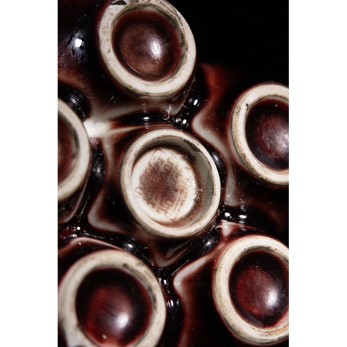 270 - A Chinese Sang de Boeuf Glazed Porcelain Five-Neck Vase - A multi-necked porcelain vase featuring a ... 