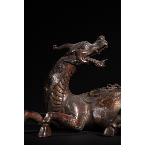 318 - A Chinese Gilt-Bronze 'Qilin' Censer, 19th Century - A cast bronze vessel sculpted in the form of a ... 