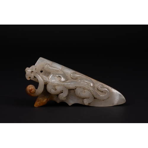 396 - A Chinese Carved Jade Belt Hook with Dragon Motif.

Carved from pale grey jade with areas of warm ru... 