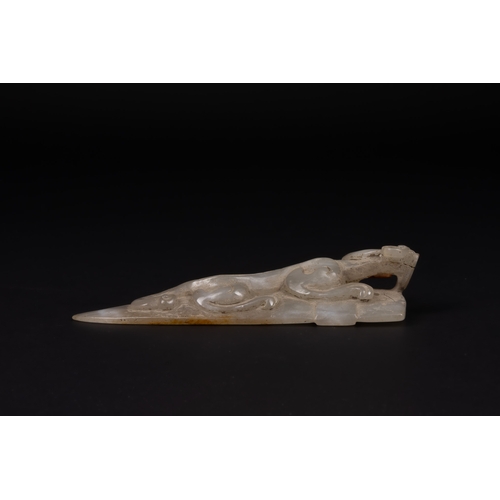 396 - A Chinese Carved Jade Belt Hook with Dragon Motif.

Carved from pale grey jade with areas of warm ru... 