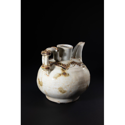 A Chinese White-Glazed Ceramic Ewer with Loop Handle and Curved Spout ...