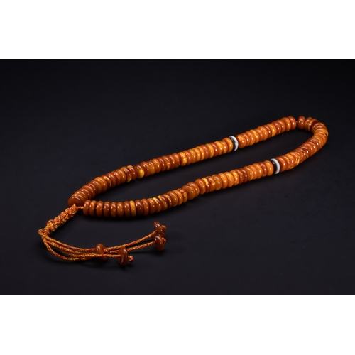 184 - An Islamic Butterscotch Amber Bead Strand.

A strand composed of rounded, flattened butterscotch amb... 