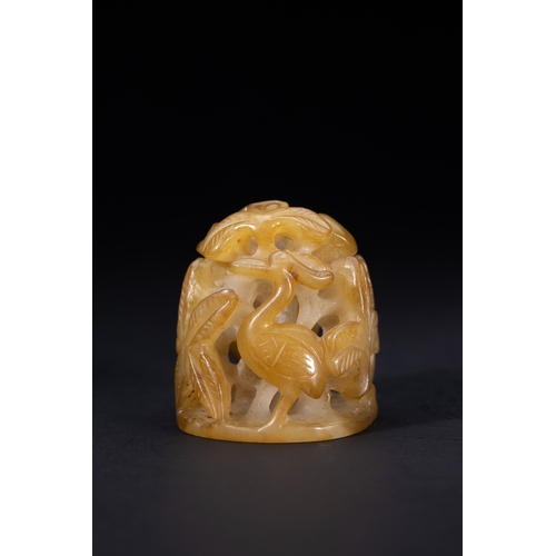 418 - A Chinese Openwork Yellow Jade Carving with Bird and Foliage Motifs.

The piece is carved from trans... 