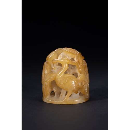 418 - A Chinese Openwork Yellow Jade Carving with Bird and Foliage Motifs.

The piece is carved from trans... 