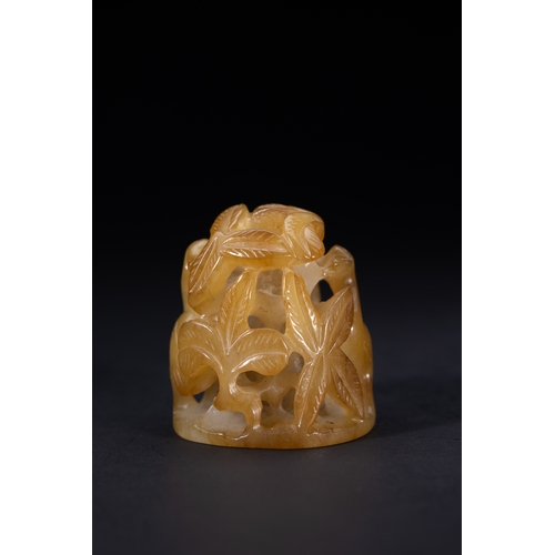 418 - A Chinese Openwork Yellow Jade Carving with Bird and Foliage Motifs.

The piece is carved from trans... 