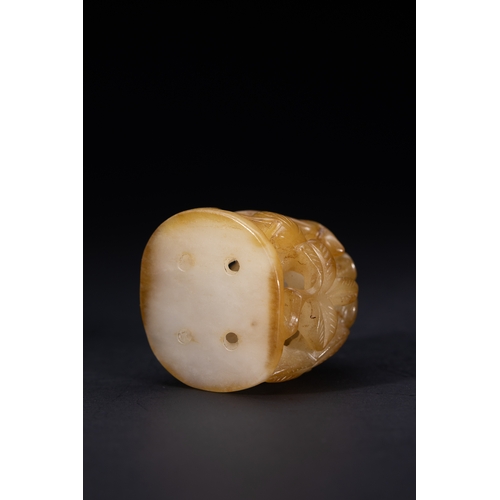 418 - A Chinese Openwork Yellow Jade Carving with Bird and Foliage Motifs.

The piece is carved from trans... 