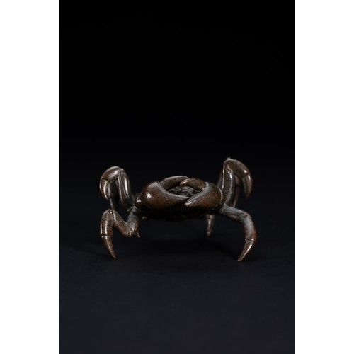 479 - A Japanese Bronze Figure of a Crab.

A naturalistically cast bronze model of a crab, shown with a br... 