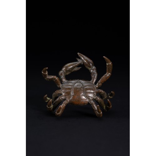 479 - A Japanese Bronze Figure of a Crab.

A naturalistically cast bronze model of a crab, shown with a br... 