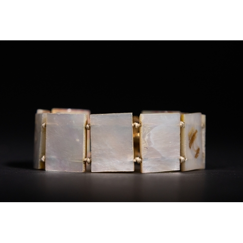 31 - A Persian Mother-of-Pearl Bracelet with Painted Enamel Scenes, 20th Century.

Composed of rectangula... 