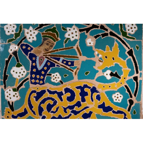 221 - A Persian Isfahan Mosaic Tile Depicting a Hunter on a Leopard, 20th Century.

The design features a ... 