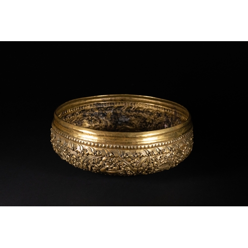500 - **NO RESERVE**

A Burmese Brass Repoussé Bowl with Floral and Animal Motifs.

A richly decorated Bur... 
