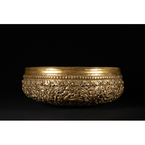 500 - **NO RESERVE**

A Burmese Brass Repoussé Bowl with Floral and Animal Motifs.

A richly decorated Bur... 