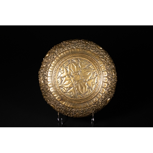 500 - **NO RESERVE**

A Burmese Brass Repoussé Bowl with Floral and Animal Motifs.

A richly decorated Bur... 