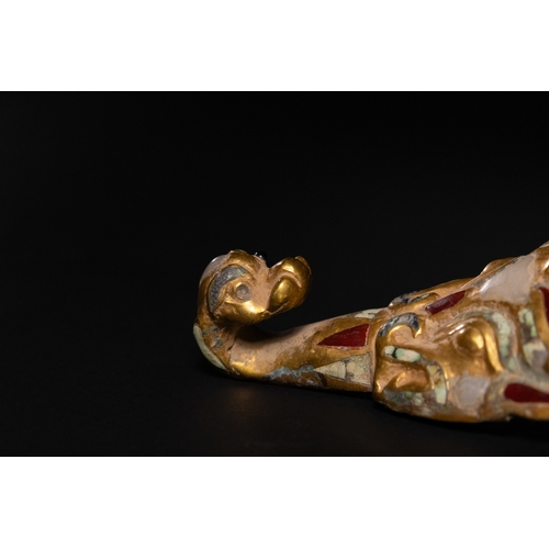 462 - A Chinese Gilt Bronze Belt Buckle with Inset Jade, Agate and Turquoise Beads, 19th Century.

A Chine... 