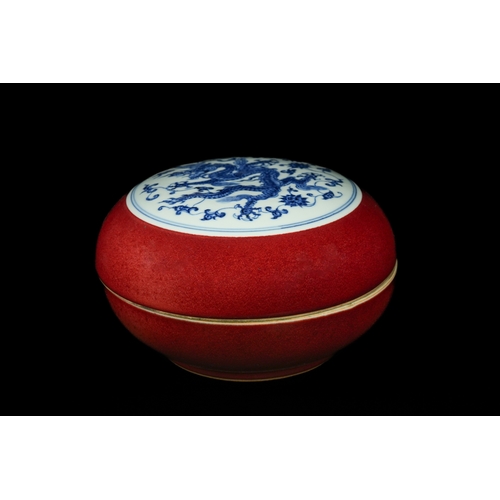 303 - A Chinese Copper-Red Glazed and Blue and White 'Dragon' Box, Xuande Mark. - A spherical porcelain li... 