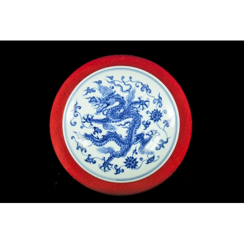 303 - A Chinese Copper-Red Glazed and Blue and White 'Dragon' Box, Xuande Mark. - A spherical porcelain li... 