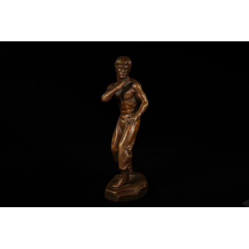 327 - A Bronze Sculpture of Bruce Lee, Attributed to Mavchi. - A bronze sculpture depicting Bruce Lee, att... 