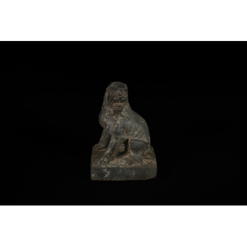 330 - A Chinese Carved Stone Guardian Lion (Foo Dog), Tang or Song Dynasty - A dark, patinated sculpture d... 
