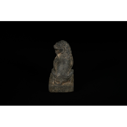 330 - A Chinese Carved Stone Guardian Lion (Foo Dog), Tang or Song Dynasty - A dark, patinated sculpture d... 