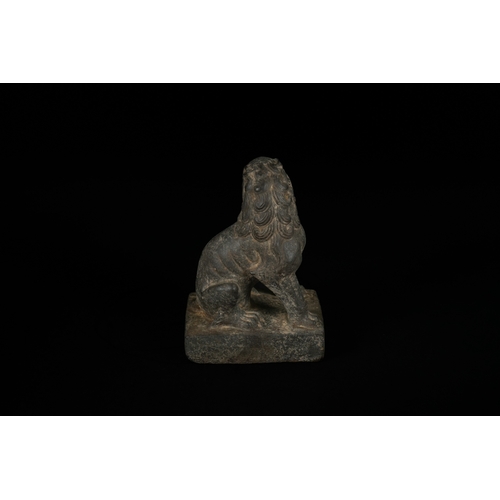 330 - A Chinese Carved Stone Guardian Lion (Foo Dog), Tang or Song Dynasty - A dark, patinated sculpture d... 
