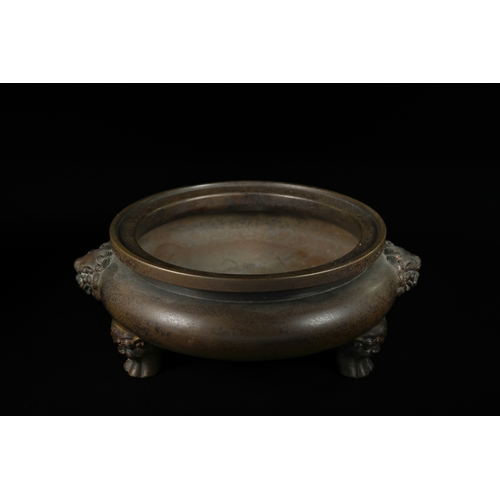 331 - A Chinese Bronze Tripod Censer, Xuande Mark. - A Chinese bronze tripod censer, featuring a circular,... 