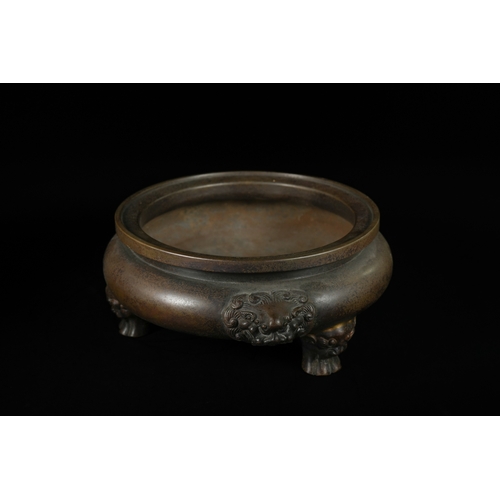 331 - A Chinese Bronze Tripod Censer, Xuande Mark. - A Chinese bronze tripod censer, featuring a circular,... 