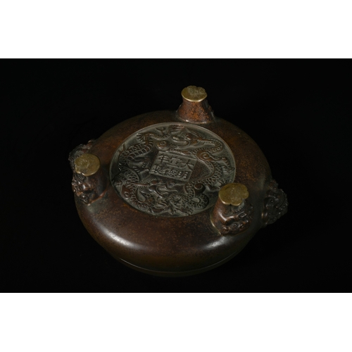 331 - A Chinese Bronze Tripod Censer, Xuande Mark. - A Chinese bronze tripod censer, featuring a circular,... 