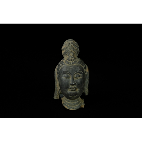 343 - An Chinese Painted Terracotta Buddha Head. - A Chinese stone head depicting Guanyin Bodhisattva, ren... 