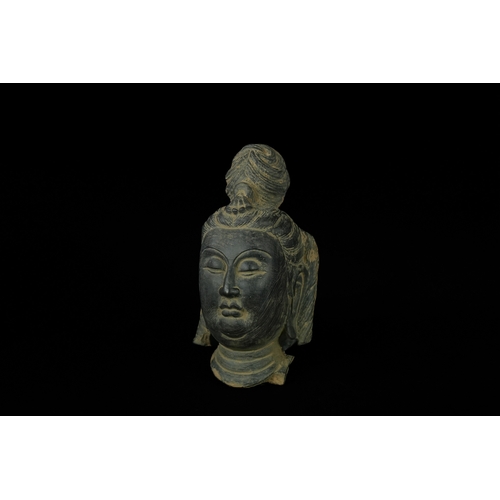 343 - An Chinese Painted Terracotta Buddha Head. - A Chinese stone head depicting Guanyin Bodhisattva, ren... 
