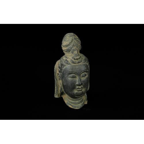 343 - An Chinese Painted Terracotta Buddha Head. - A Chinese stone head depicting Guanyin Bodhisattva, ren... 